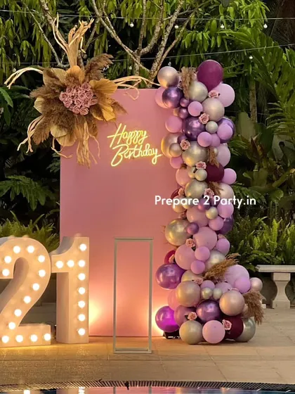 For a chic 21st birthday, I designed this sophisticated outdoor setup by the pool. It combines a modern pink backdrop, a custom neon sign, and an elegant balloon garland with pampas grass and floral arrangements for a trendy, bohemian vibe.