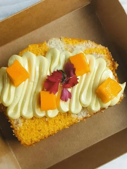 For parties and bulk orders, I offer individual cake slices. Here are two of my popular flavors: the tropical Coconut Mango and the rich Choco Pistachio marble cake slices.