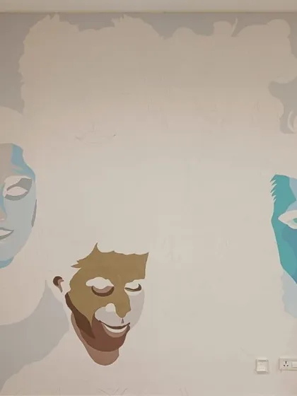 The initial blocking of colors for our 'I choose to be happy' portrait mural in a hospital.