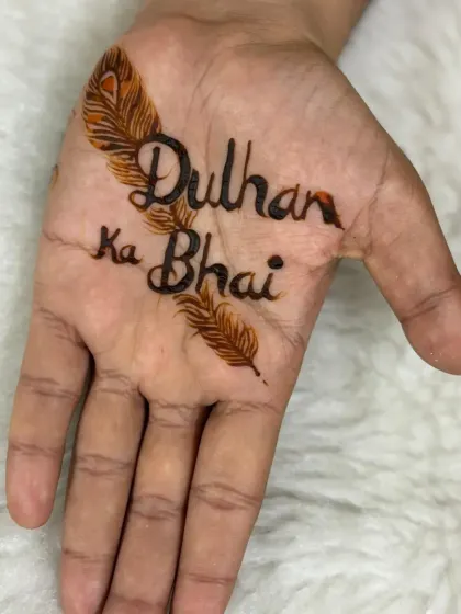 A simple yet elegant design for the "Dulhan ka Bhai" (bride's brother). The text is beautifully written and adorned with peacock feathers, making it a stylish way to celebrate his role.