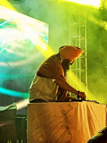 An artistic shot of me mixing amidst stage smoke and lights. I believe a true artist finds a way to be themselves in their art.