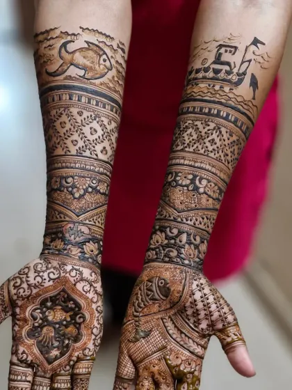 Full view of the Koli-themed bridal mehendi, celebrating the bride's roots with unique motifs of fish and boats integrated into a traditional design.