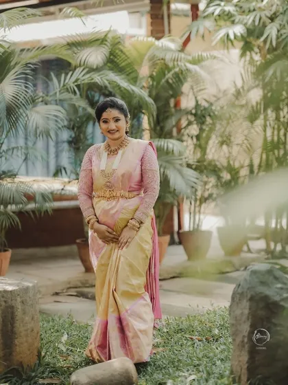 The soft pastel colors of Vaishnavi's saree are perfect for a daytime event, exuding a gentle and feminine charm.