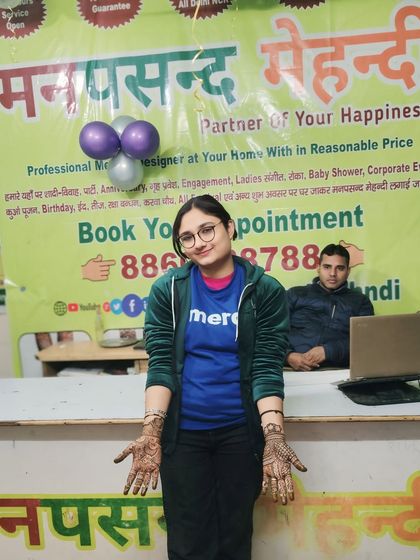 A happy client at our free New Year mehndi camp. We love giving back to our community and spreading joy through our art.