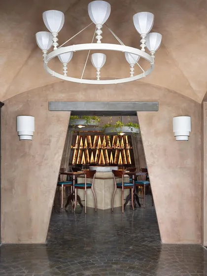 For Watson's Pub in Kochi, we created a contemporary interpretation of a hacienda courtyard. The design features a unique flat arch and vaulted ceilings, blending the brand's friendly vibe with the building's historic legacy.