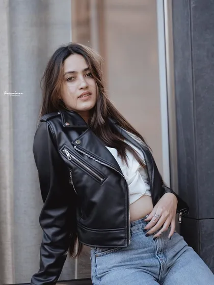 This is an example of my urban portrait work, capturing a relaxed, confident look in a city setting. I use the environment to frame the subject, creating a portrait that feels both candid and professionally styled.