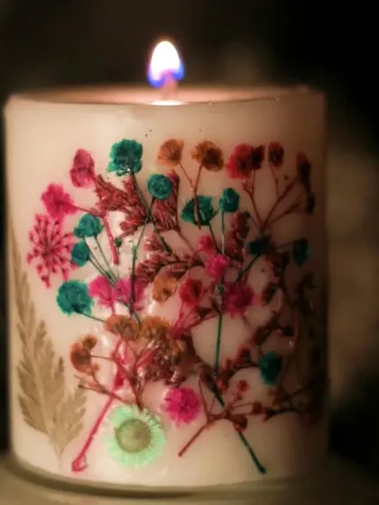 Unwind your day with our Divine Floral Love Candle. This image captures its gentle glow, perfect for thoughtful gifting. This one was handcrafted in a pure sandalwood fragrance.