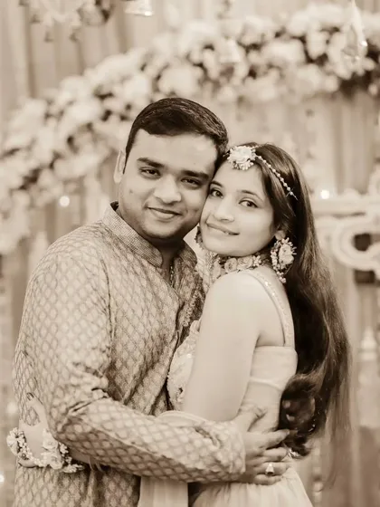 A sweet portrait of a bride with her brother at her Haldi ceremony. Their warm embrace shows the special bond between siblings on a very important day.