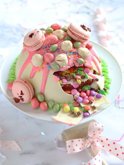 The best part of our Piñata Cake is the moment it breaks open. It’s a perfect, interactive centerpiece for a child's birthday party, combining a delicious red velvet cake with the excitement of a surprise.