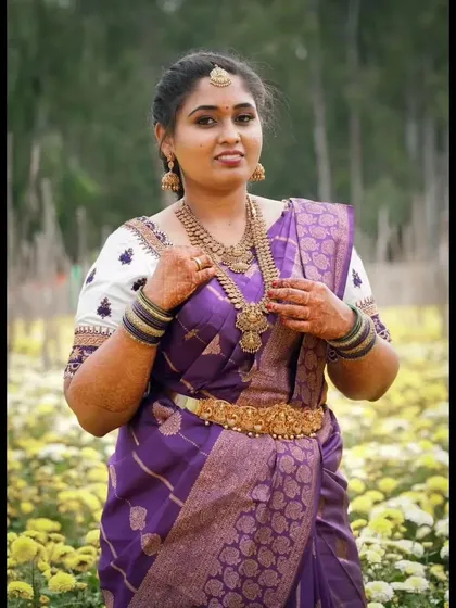 Your photoshoot makeup needs to look great in any lighting, including bright daylight. Here, I ensured her skin had a smooth, long-lasting finish that wouldn't fade, perfectly complementing her vibrant purple saree for this outdoor shoot.