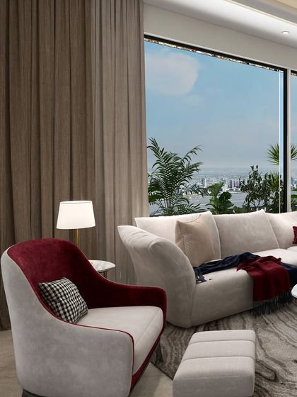 A neutral palette speaks softly, with just a whisper of red. This subtle pop of color in the armchair breathes warmth and depth into the room, making the corner feel alive yet calm.