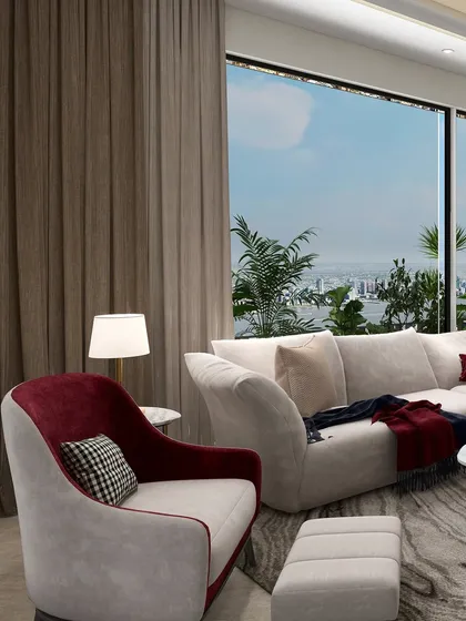 A neutral palette speaks softly, with just a whisper of red. This subtle pop of color in the armchair breathes warmth and depth into the room, making the corner feel alive yet calm.
