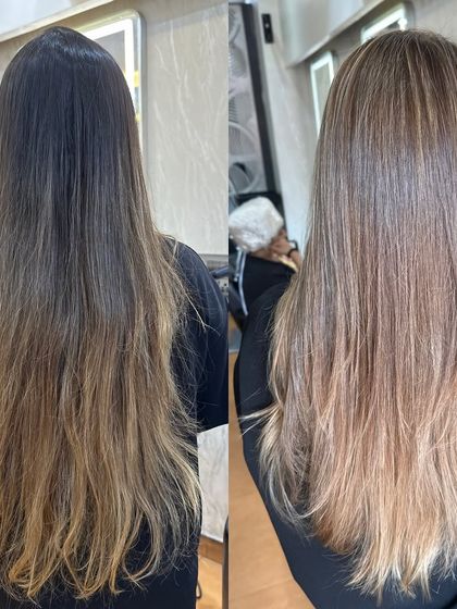 A clear before and after of the Pearl Ash Blonde transformation. We corrected the old, brassy color to create this beautiful, cool-toned look.