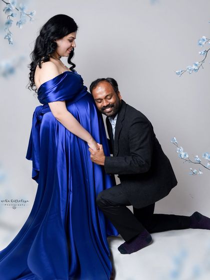 Capturing the joy and connection from a different angle. The genuine smiles in this shot show the couple's happiness as they look forward to meeting their baby.