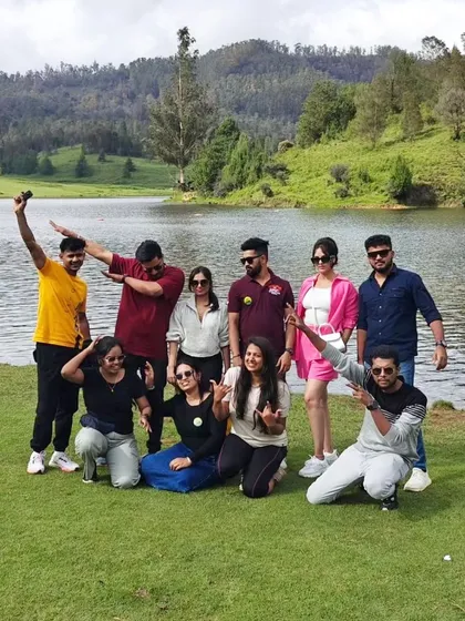 A fun group photo by the lake in Kodaikanal. Our trips are all about creating happy memories and enjoying the beauty of nature together.