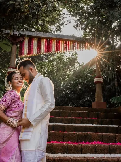 A bride basking in the golden hour glow. We chase beautiful light to create artistic portraits like this one of Aishwarya, capturing her radiance and joy as she steps into a new beginning at The Peacock Grove.