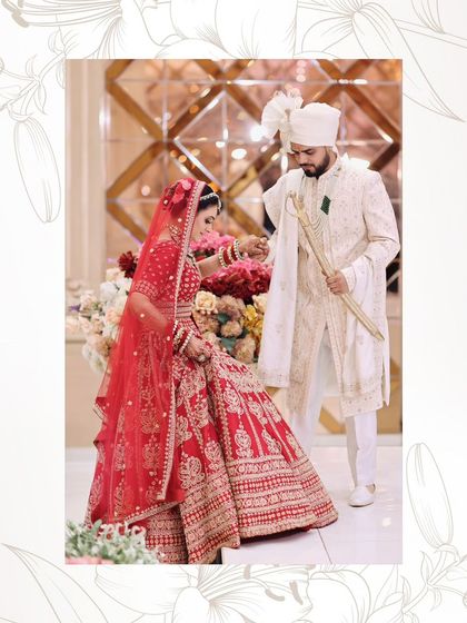 A candid shot from the wedding ceremony. The bride's makeup is flawless as she participates in the rituals.
