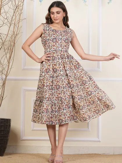 Another view of the neutral-toned tiered dress, highlighting the beautiful details of the hand-block print.