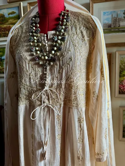 A close-up of the bodice, showing the intricate Kasab work and tie-up detail.