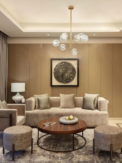 We believe a living room should feel personal and timeless. In this space, we layered textures and neutral tones with carefully chosen art and lighting to create an atmosphere of quiet sophistication. The design invites you to linger, to have conversations, and to feel completely at ease.