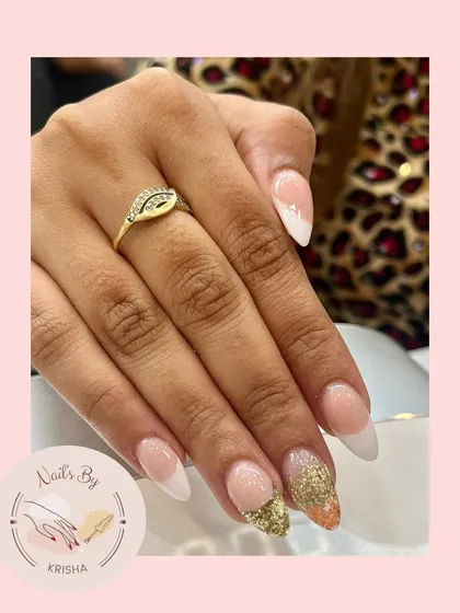 An elegant set featuring acrylics with paper forms, combining a classic French tip style with a bold gold and orange glitter accent nail.