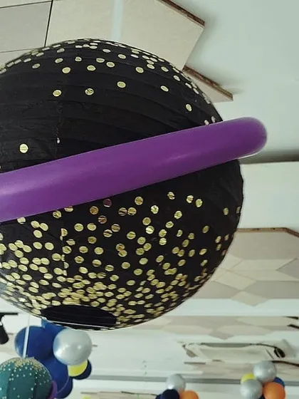 It's the little details that make a theme come alive. This paper lantern, transformed into the planet Saturn, was part of our out-of-this-world space-themed party decor.