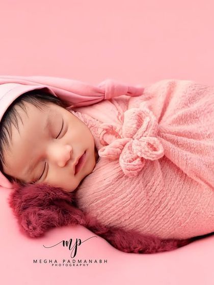The side-profile 'potato sack' pose in a lovely shade of pink, complete with a sleepy hat.