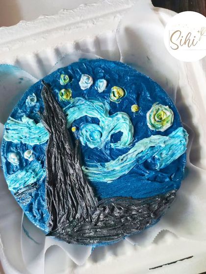 An edible masterpiece inspired by Van Gogh's "The Starry Night." I used textured buttercream in different shades of blue, yellow, and black to recreate the iconic painting on a bento cake.