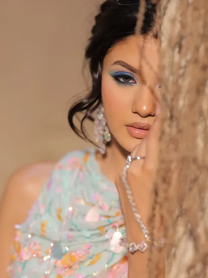 A creative shot of the carnival look, with the blue eye peeking through.