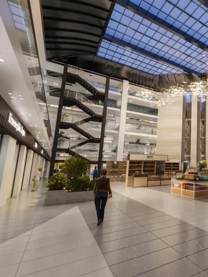In our commercial projects, we focus on creating immersive experiences. This view of an upcoming mall shows how we use multi-level sightlines, a soaring glass ceiling, and sculptural elements to design a retail environment that encourages exploration and connection.