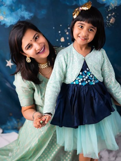 A magical bond between mother and daughter. Their happy smiles in this dreamy, celestial-themed shoot create a beautiful and heartwarming portrait.
