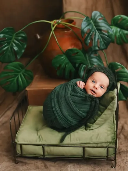 For this session, we created a lush, botanical dream. I love designing unique, themed newborn photoshoots that tell a story, surrounding your baby in a world of wonder while they are safely and comfortably wrapped.