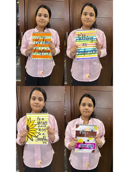 I am so proud to see my students flourish. This is one of my young artists proudly displaying four of her completed calligraphy projects, each showcasing a different style, color palette, and positive message.