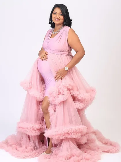 A beautiful maternity shoot. We went for a soft glam look to enhance her radiant pregnancy glow. She looks absolutely stunning in this pink ruffled gown.