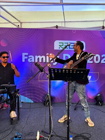 Our guitarist and drummer in action during a performance for Rebit's Family Day 2024.