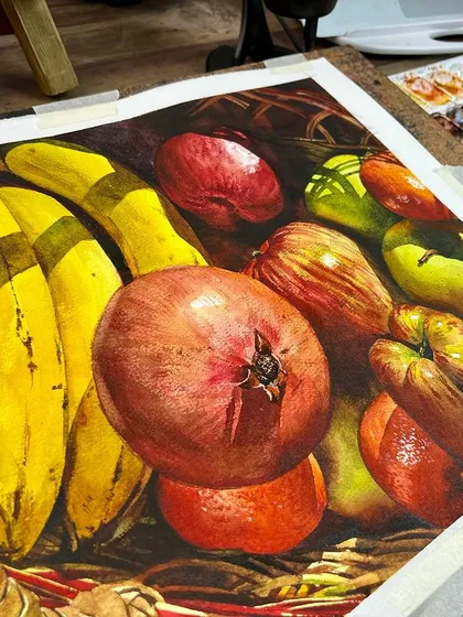 The fruit basket still life on my easel, showing the work in progress next to my palette.
