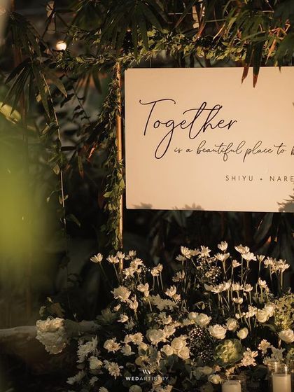 A serene and elegant all-white wedding reception theme. The clear-top tent allows guests to dine under the stars, while the minimalist decor highlights the natural beauty of the surrounding greenery at The Farmhouse Collective.