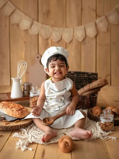 This little baker is ready to get to work! The chef theme is such a fun and interactive setup for a toddler milestone session.