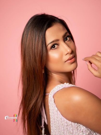 This portrait of Niviksha captures a moment of quiet elegance, with a focus on her profile and the beautiful designer outfit.