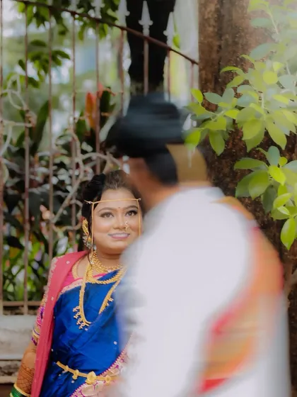 An artistic shot capturing the bride's loving gaze towards the groom, creating a sense of intimacy and anticipation.