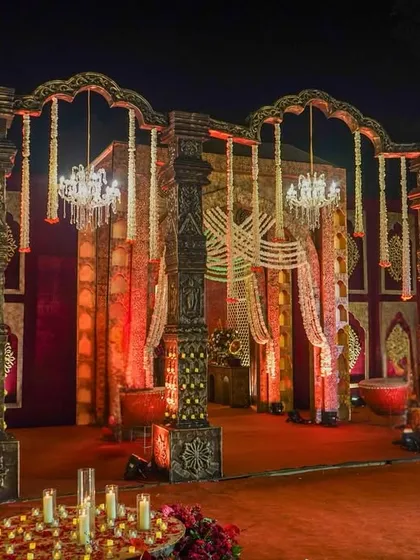 A stage built on a foundation of heritage. I used antique carved pillars, velvet panels with gold motifs, and hanging crystal chandeliers to create a dramatic and regal backdrop.