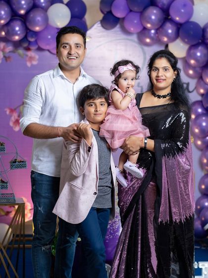A beautiful family portrait from the purple-themed celebration.