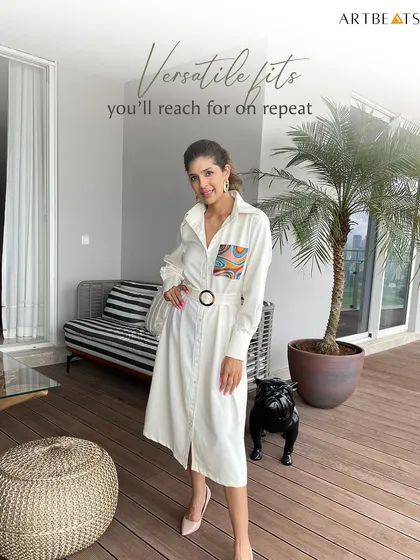 A versatile fit you'll reach for on repeat. The Moonrise Trench Dress, seen here styled in a modern home, is a perfect example of an elevated basic with an artistic twist.