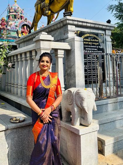 Pooja's smile and elegant posture show how a beautiful saree can make you feel confident and proud.