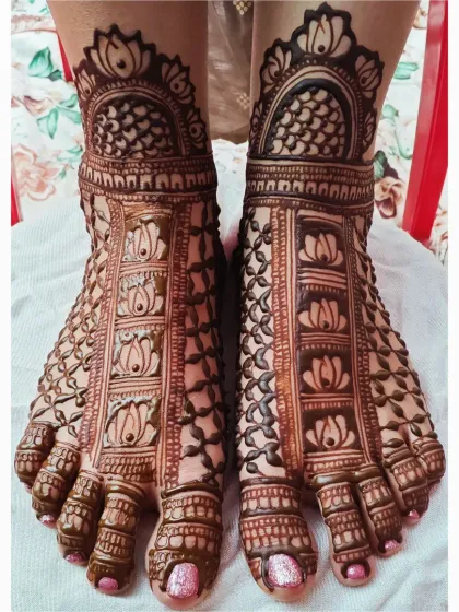 A close-up of my bridal feet mehendi work. This design features repeating lotus motifs, a symbol of purity and beauty, set within a grid pattern that covers the entire foot for a complete and elegant look.