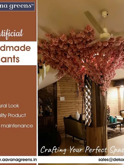 Crafting your perfect space with handmade plants. This ceiling installation of pink blossoms creates a stunning, romantic canopy in this elegantly designed room.