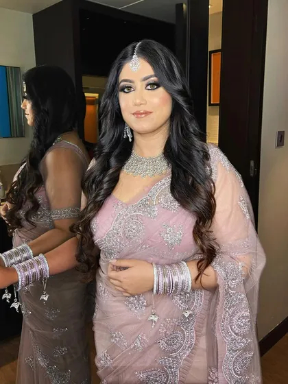The final look for this engagement bride. The smokey eye, defined brows, and contoured features come together for a polished and glamorous appearance, perfect for her special day.