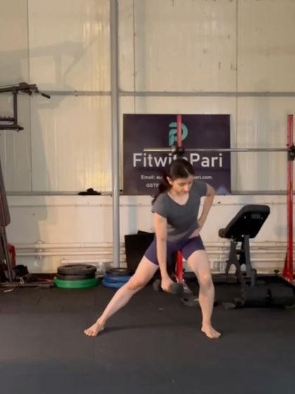 A side lunge with a dumbbell. This move is excellent for building strength and flexibility in the inner and outer thighs.