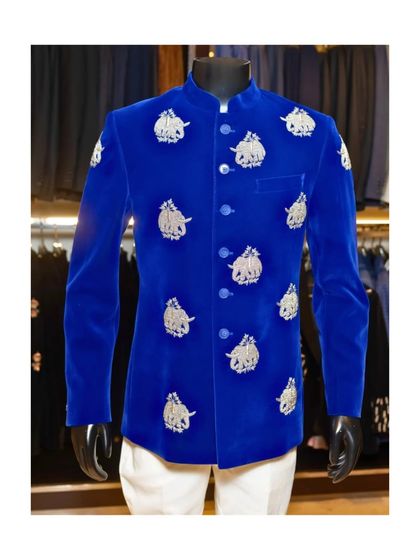 The full view of the royal blue velvet bandhgala, styled on a mannequin. This piece is a guaranteed head-turner, combining a vibrant color with traditional Indian artistry.