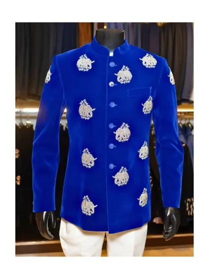 The full view of the royal blue velvet bandhgala, styled on a mannequin. This piece is a guaranteed head-turner, combining a vibrant color with traditional Indian artistry.